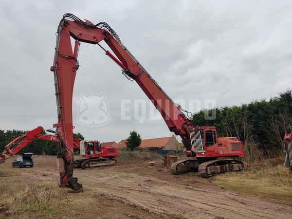 Foto van de Liebherr R 954 B met lange sloopgiek (28m), standaard giek en graafbak